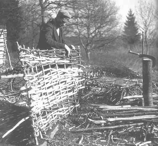 Len Lane at work hurdlemaking, creating a panel of woven wood.