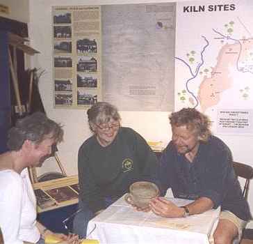 Experts examined a Verwood Pot at a small table during a recent