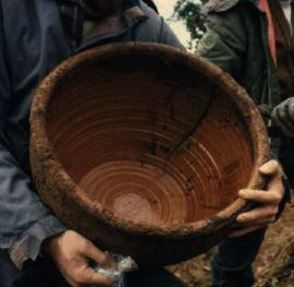 A large pottery vessel is unearthed