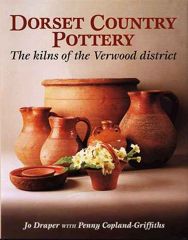 The cover illustration: A Verwood Pottery bread bin, a group of jugs, a costrel and several smaller vessels one of which holds a posy of primroses stand in a pool of light.